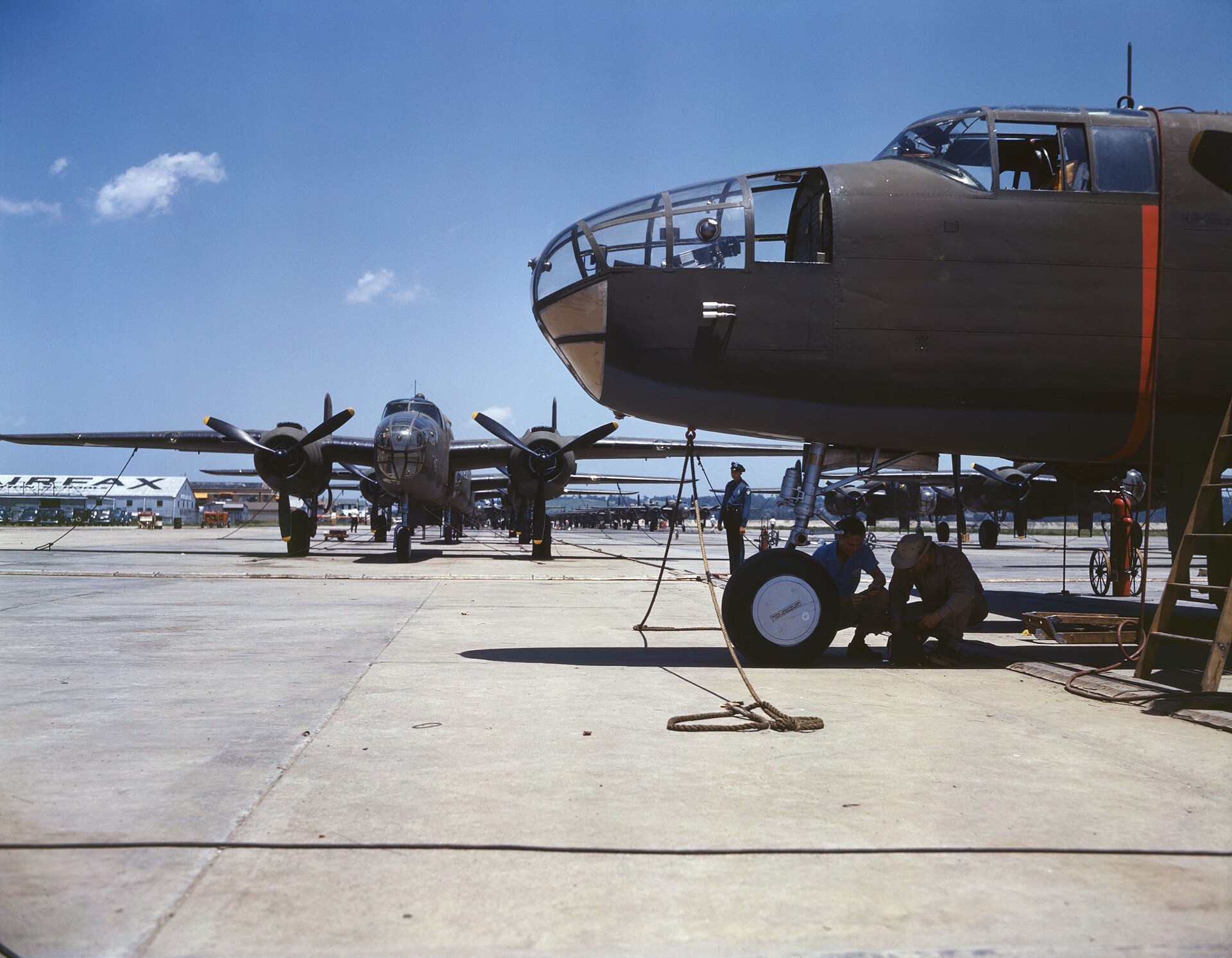 New bombers lined up on an aircraft plant's flying field for final inspection and tests