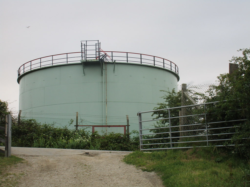 Large oil storage tanks standing side by side at an oil depot