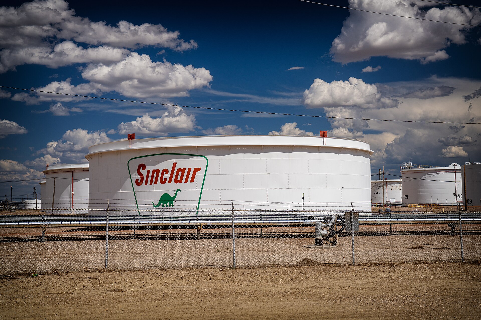 Rows of white oil storage tanks at the Sinclair oil refinery in Wyoming