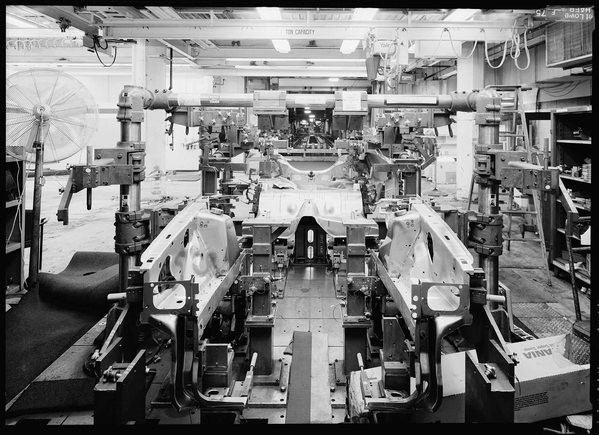 A coordinate measuring machine in a layout room at an engine plant, with the measured part on the granite table