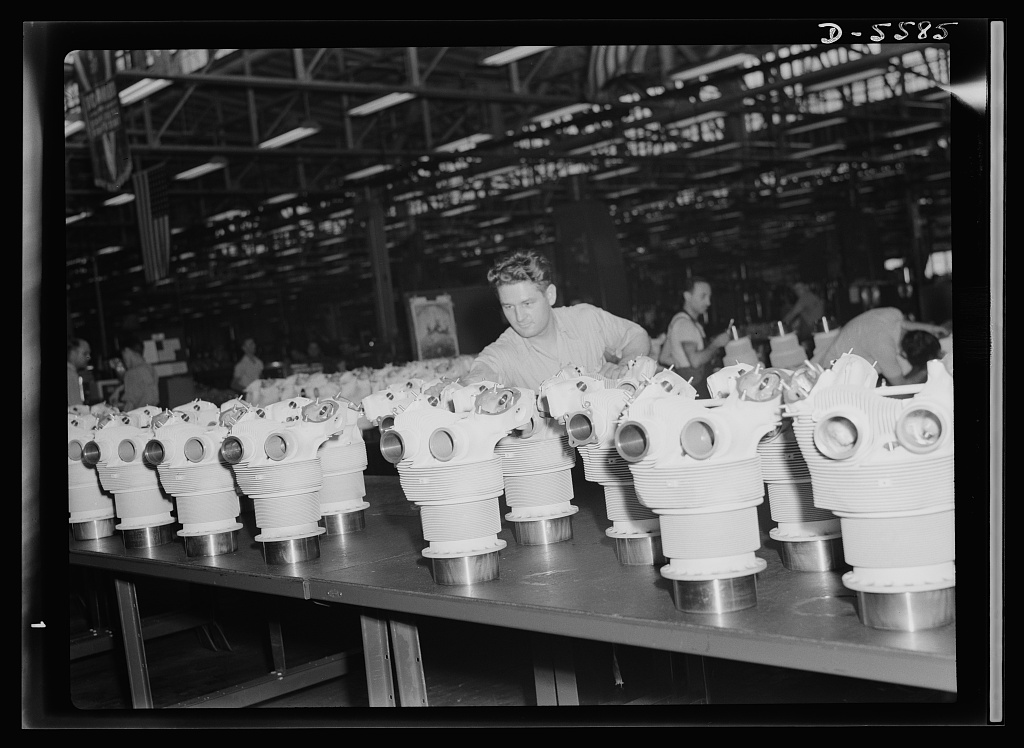 A line of machined cylinder barrels on a bench, ready for inspection