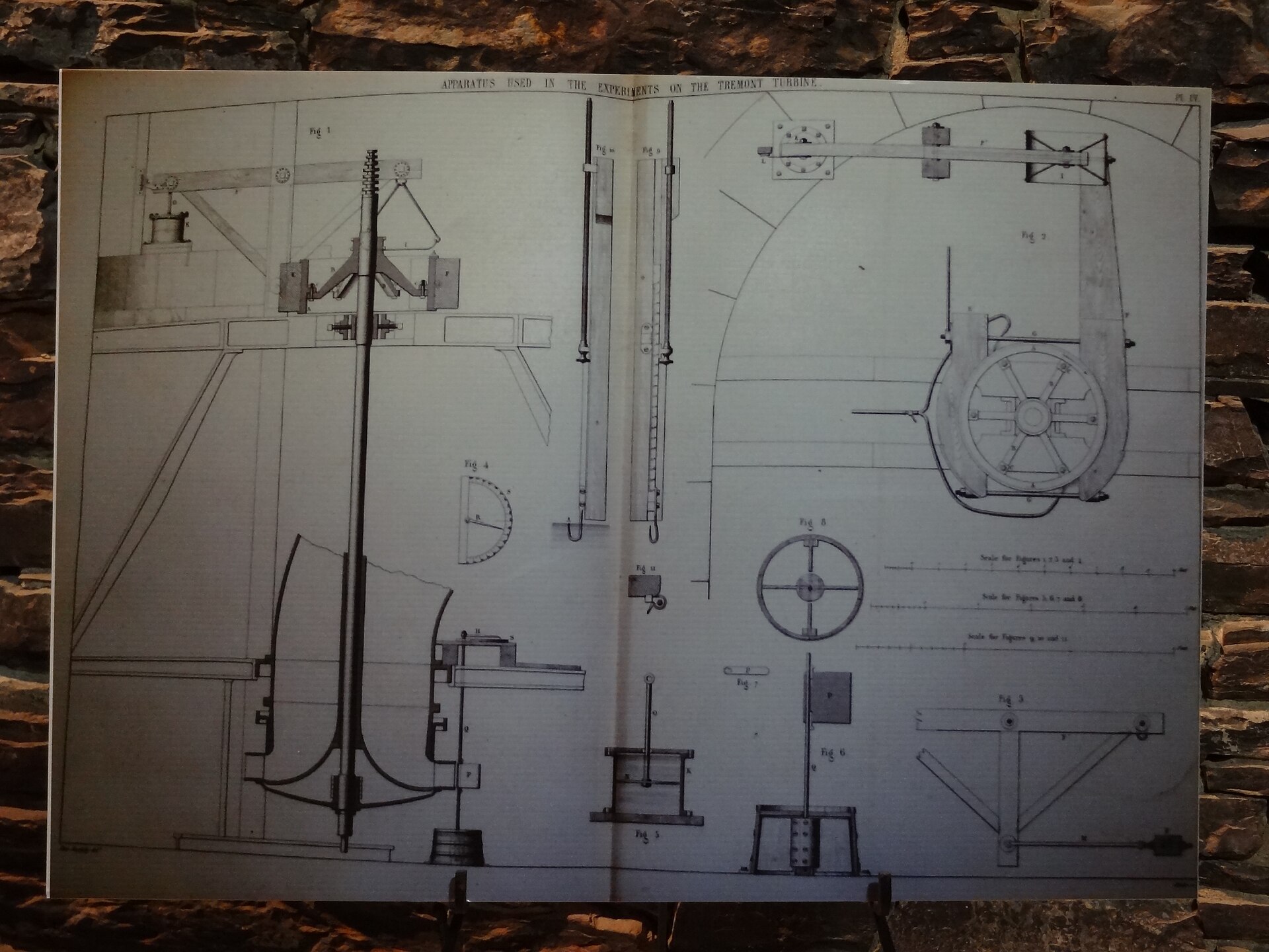 A detailed technical drawing of a turbine apparatus with dimension annotations
